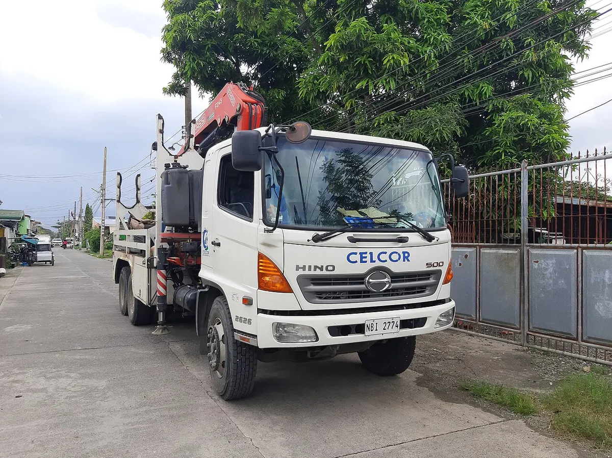 Utility crew working from a bucket truck, the kind of licensed field work that also covers the electrical side of a generator install