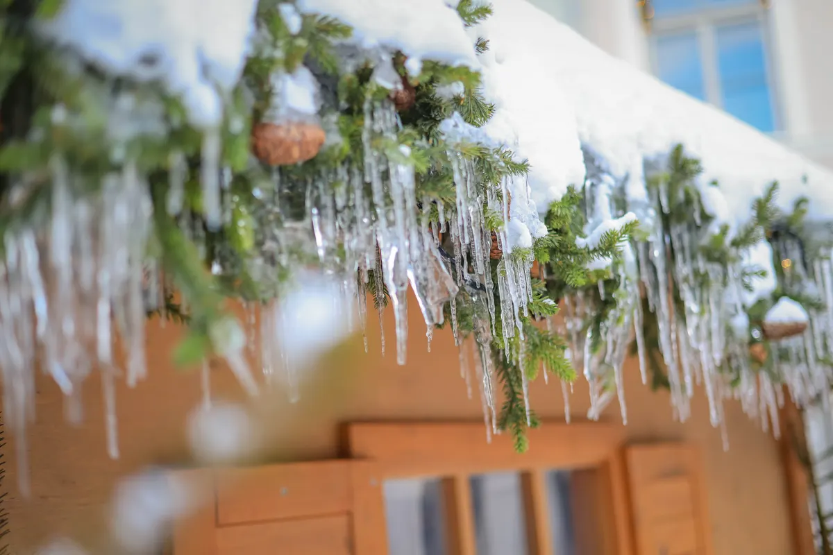 Icicles and snow along a North Shore roofline, the kind of hard freeze that means it's time for generator winter maintenance