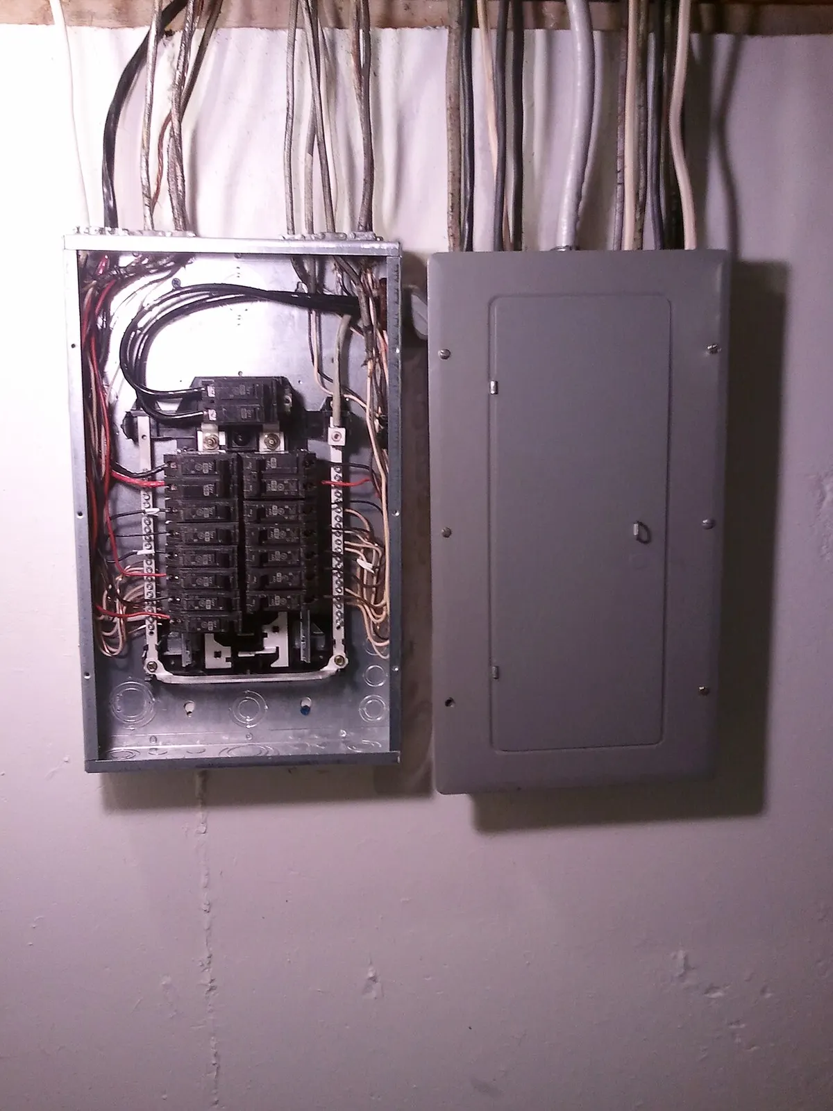 Home electrical panel where an automatic transfer switch connects a Generac or Briggs and Stratton standby generator