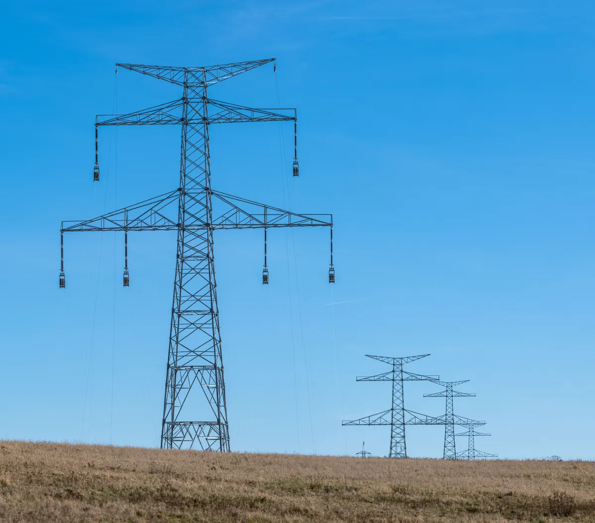 High voltage transmission towers carry the electricity that strains during a Chicago polar vortex power outage event